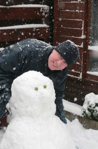 Dad Building a Snowman